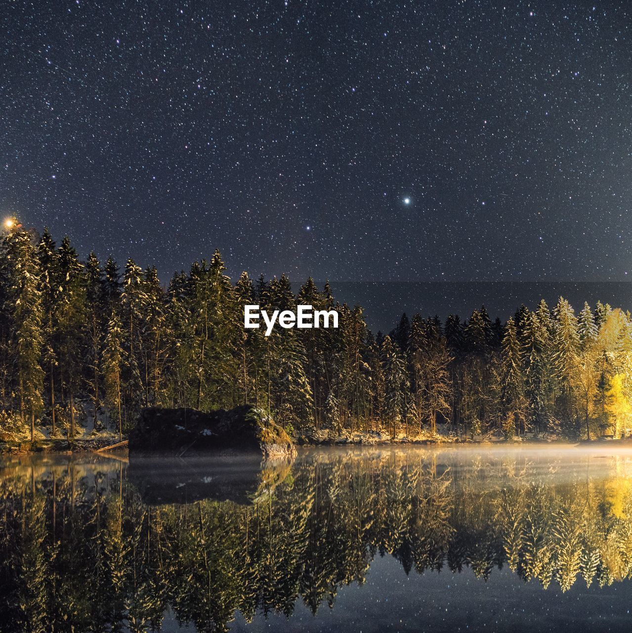 VIEW OF LAKE AGAINST SKY AT NIGHT