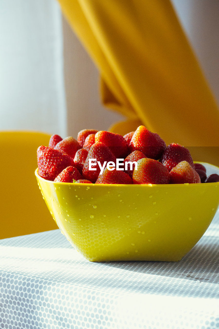 Close-up of fresh fruits in bowl on table