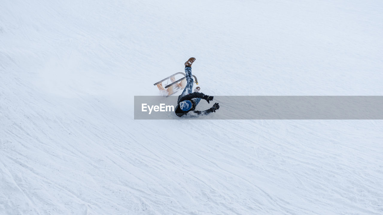 Man falling on slope