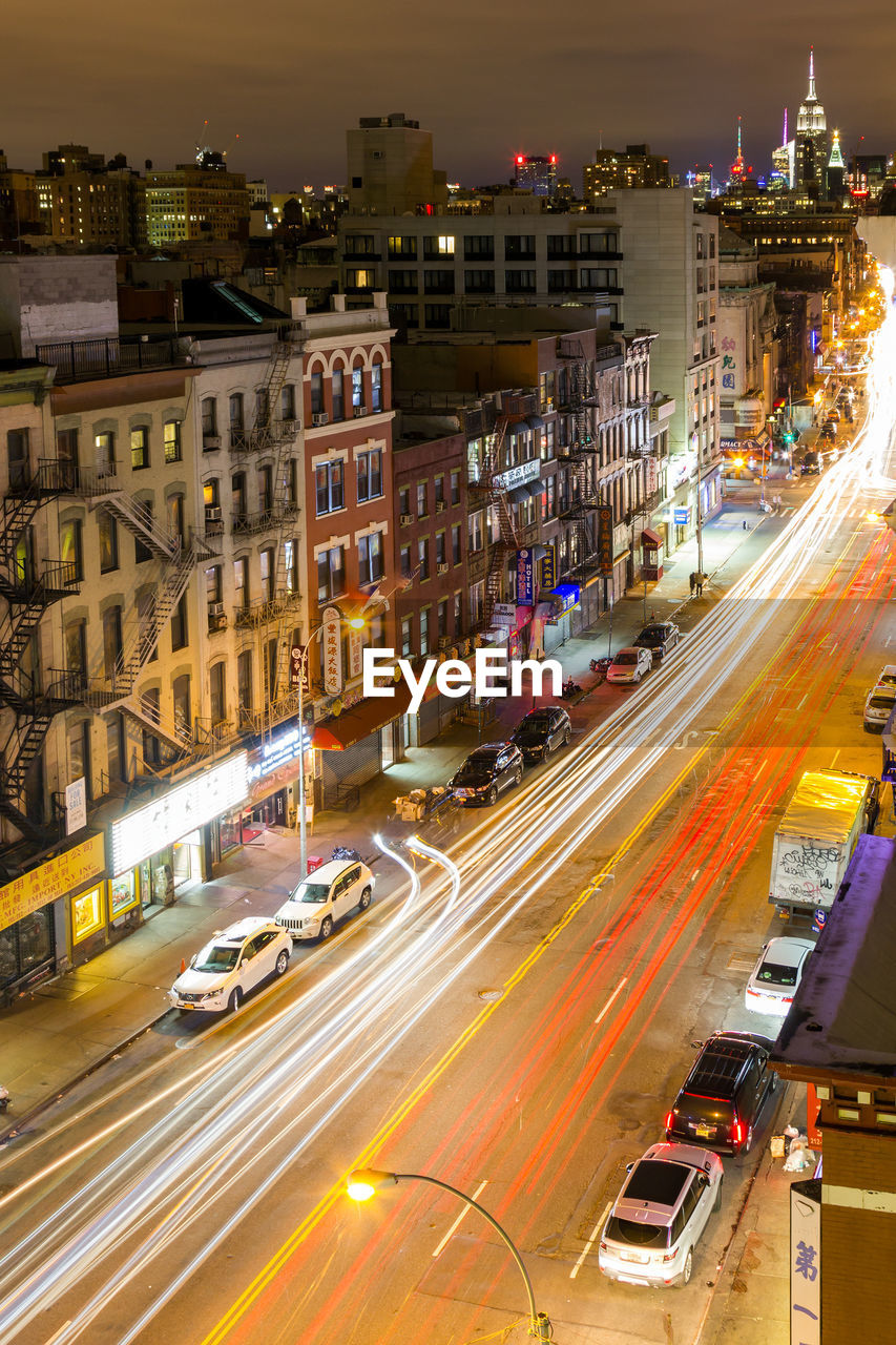 HIGH ANGLE VIEW OF LIGHT TRAILS ON CITY STREET