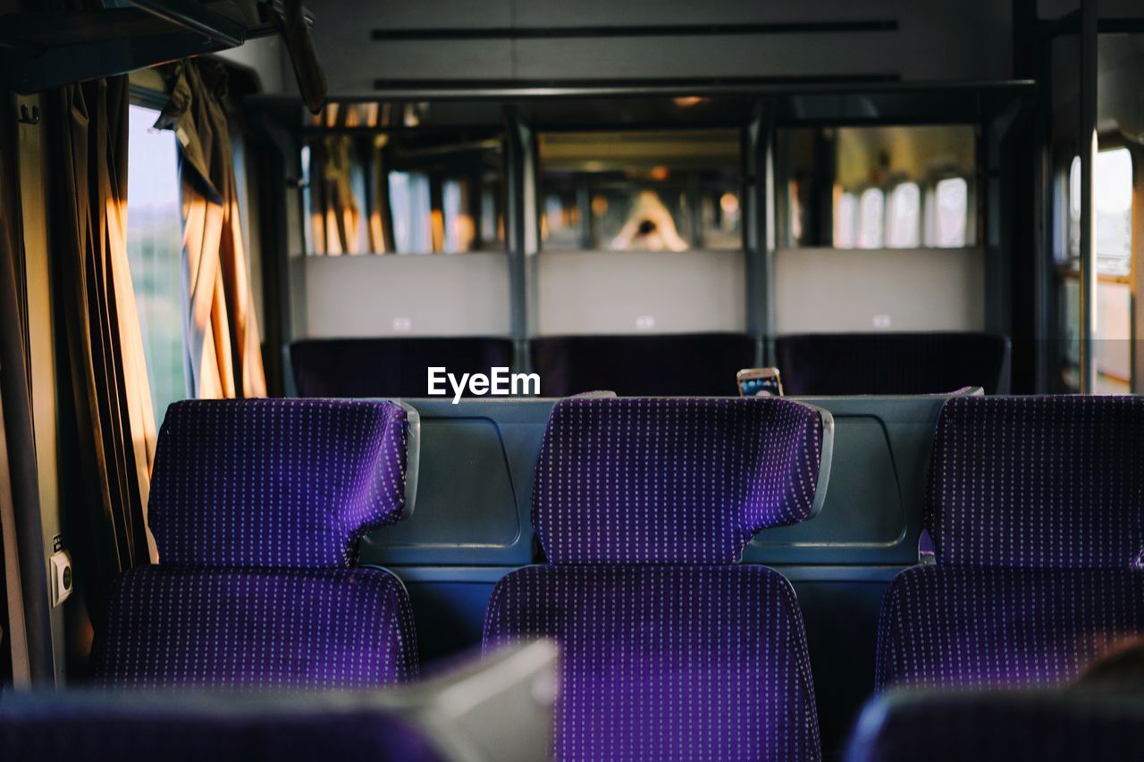 Empty purple seats in train