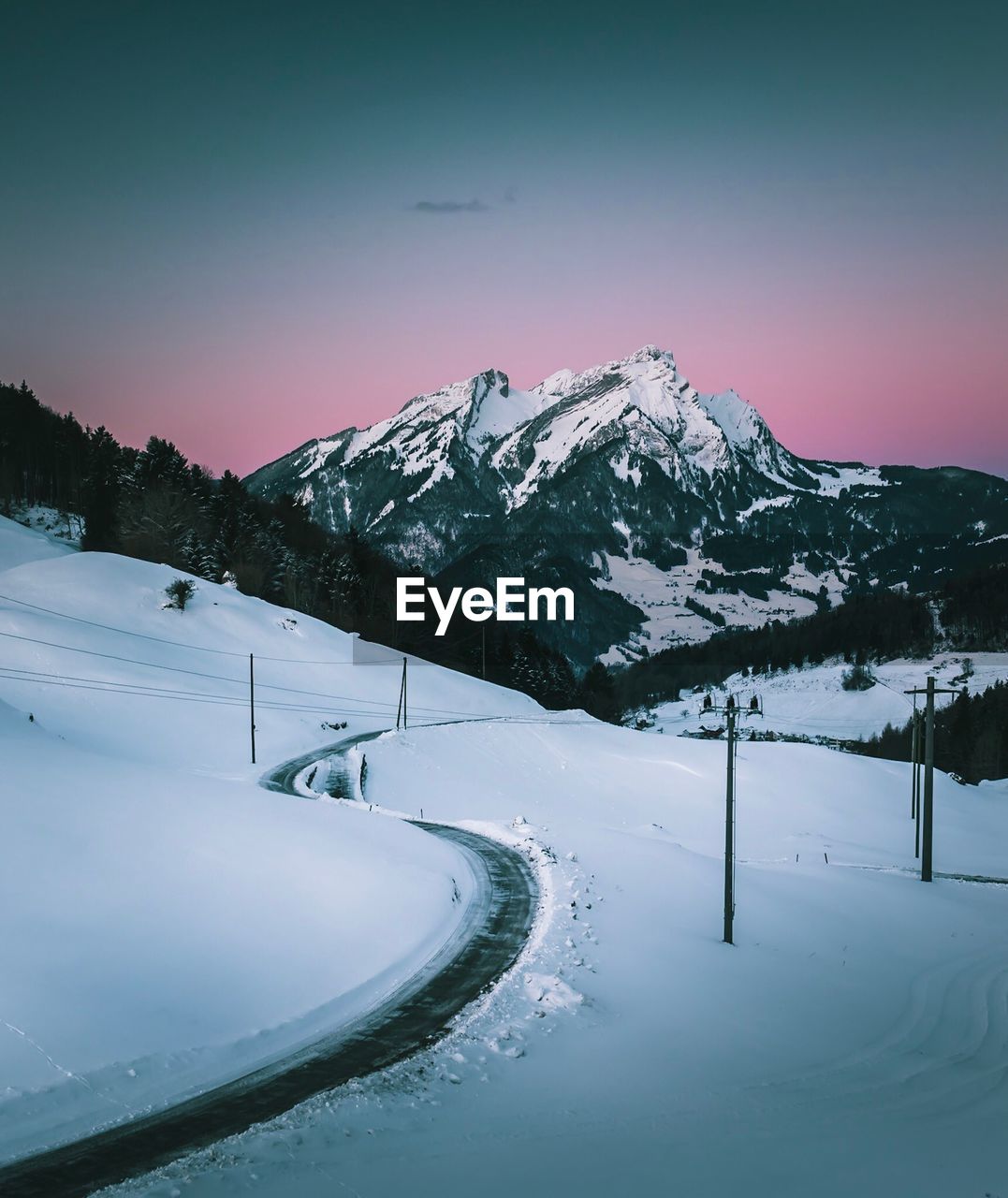 Scenic view of snowcapped mountains against clear sky