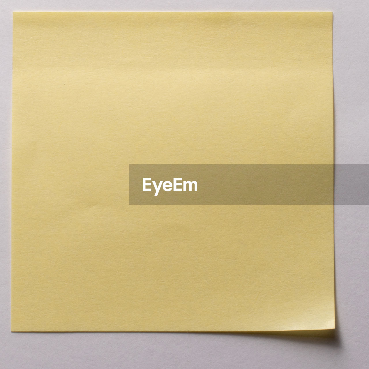 CLOSE-UP OF A YELLOW PAPER