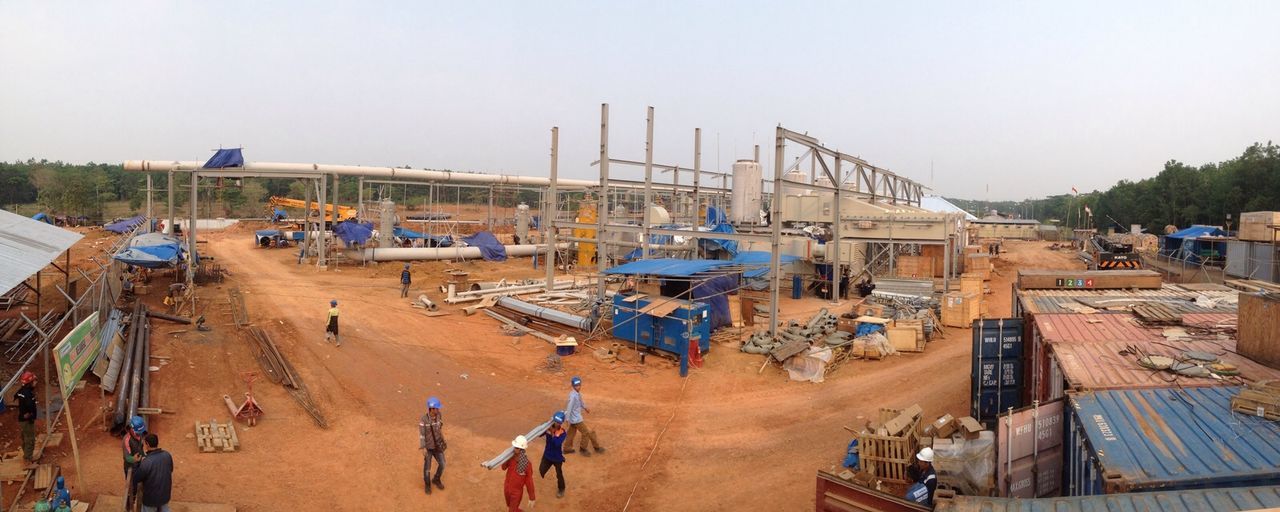 Panoramic shot of industrial units against clear sky