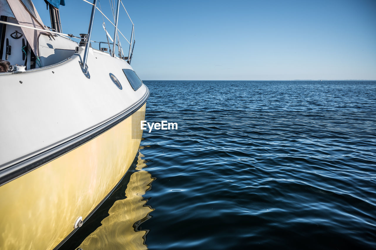 boat in sea against clear sky