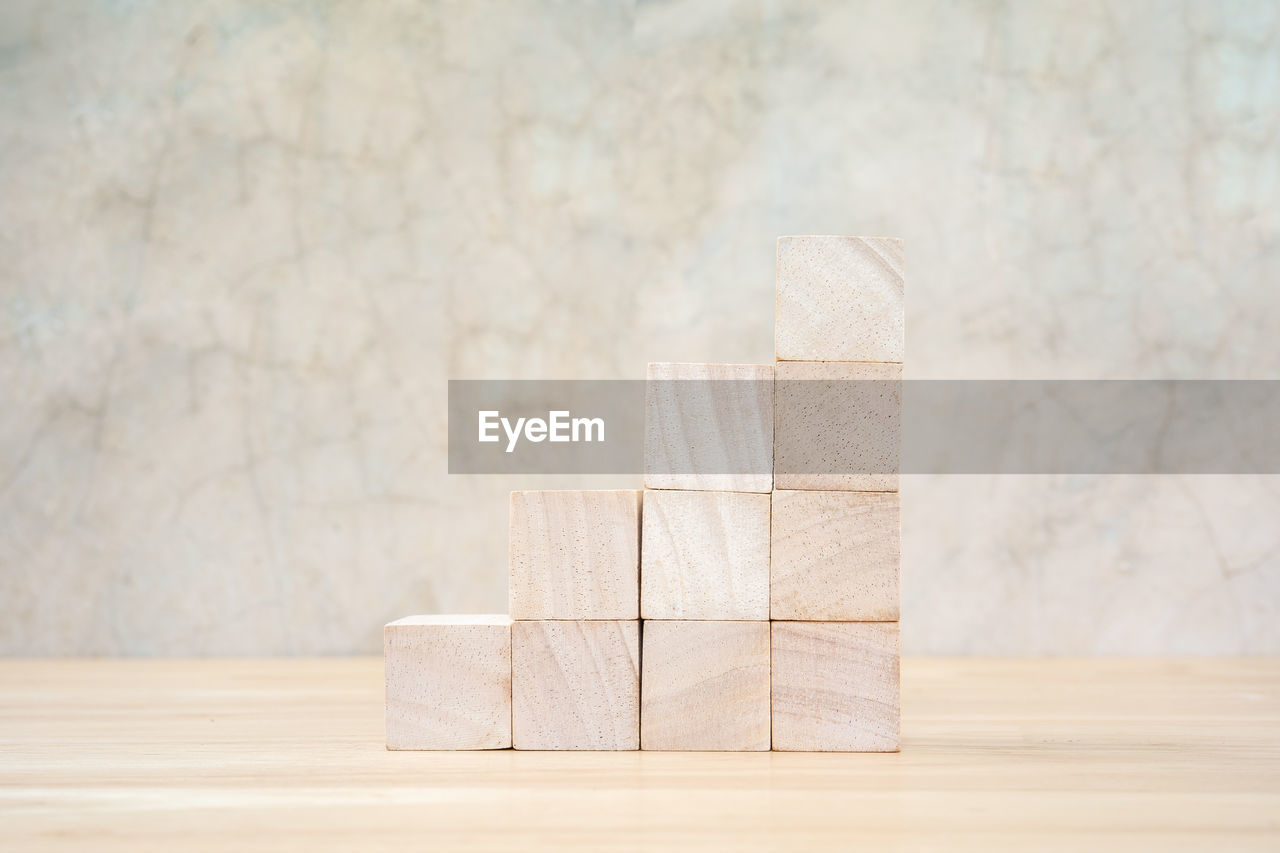 CLOSE-UP OF TOY ON WOODEN TABLE