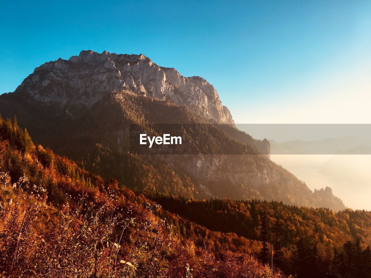 Scenic view of rocky mountains against clear blue sky