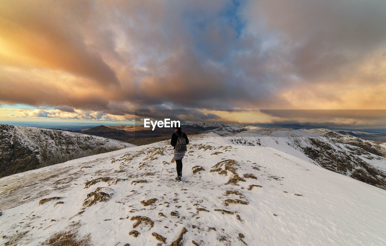 Rear view of woman on snow landscape