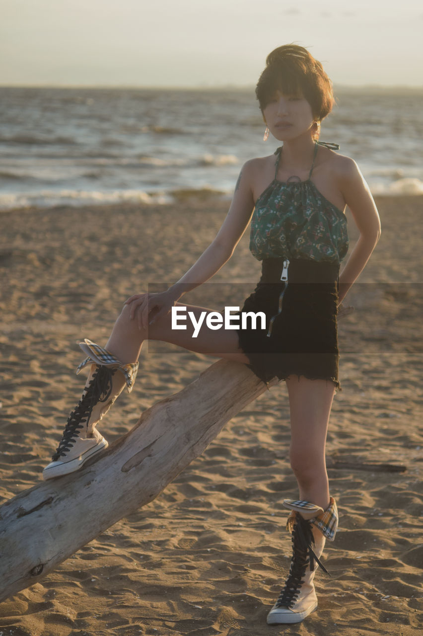 Full length of young woman on beach