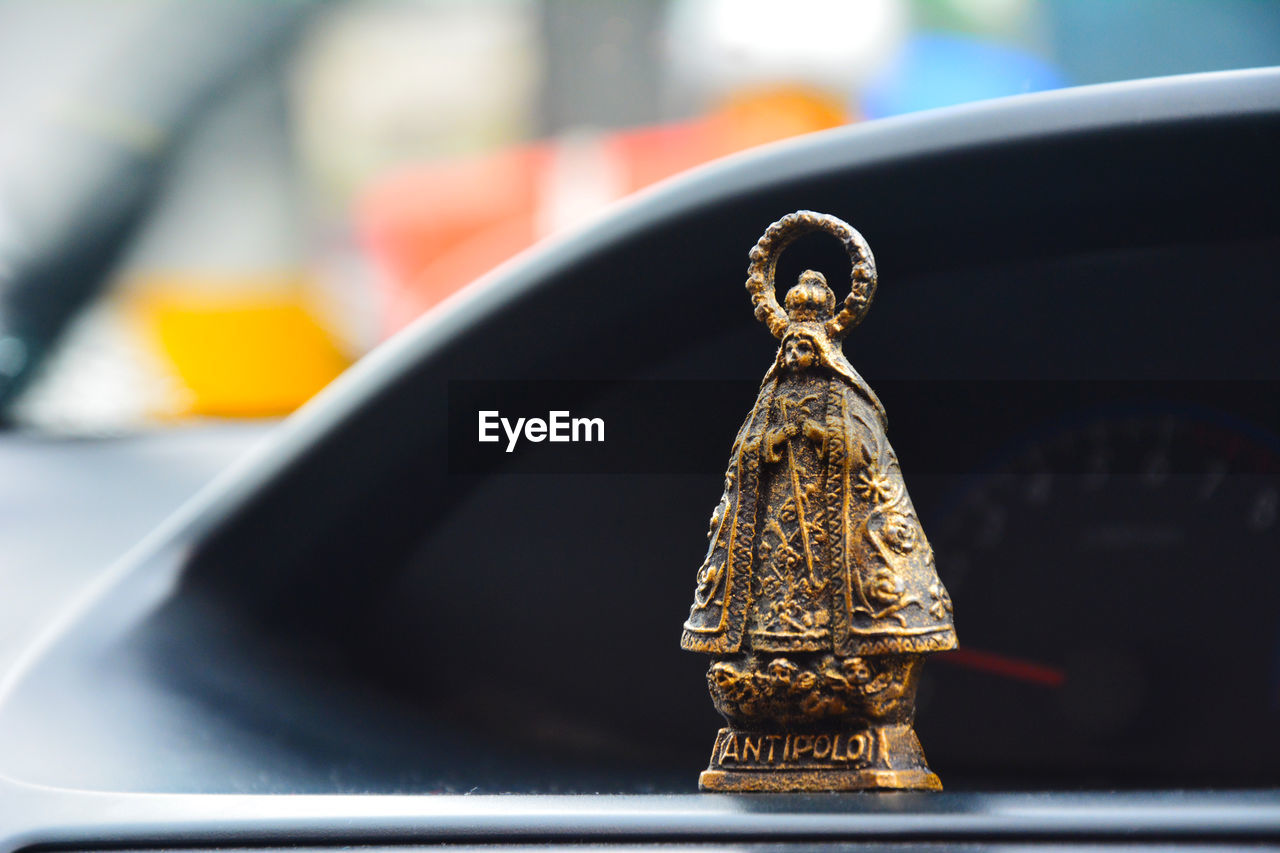 Close-up of figurine in car