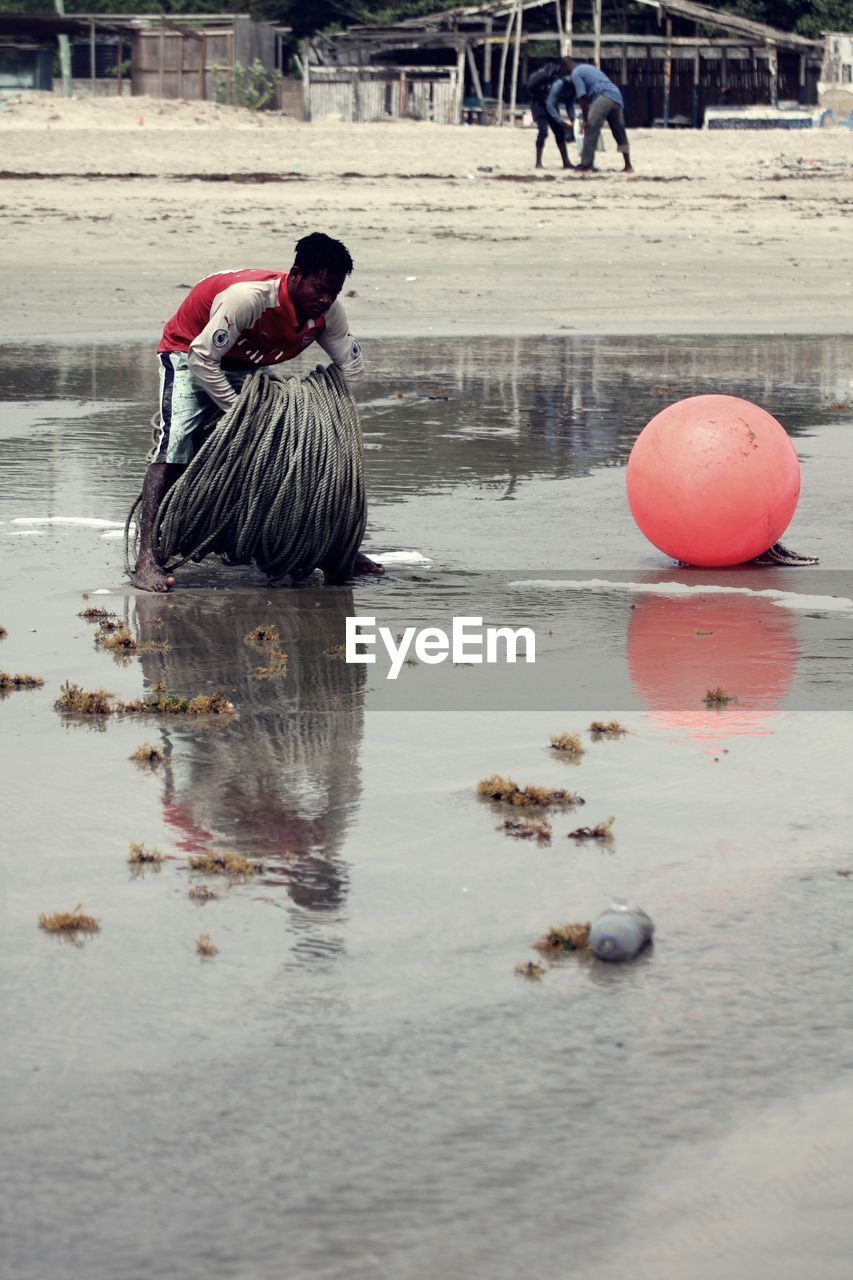 Man working at beach 