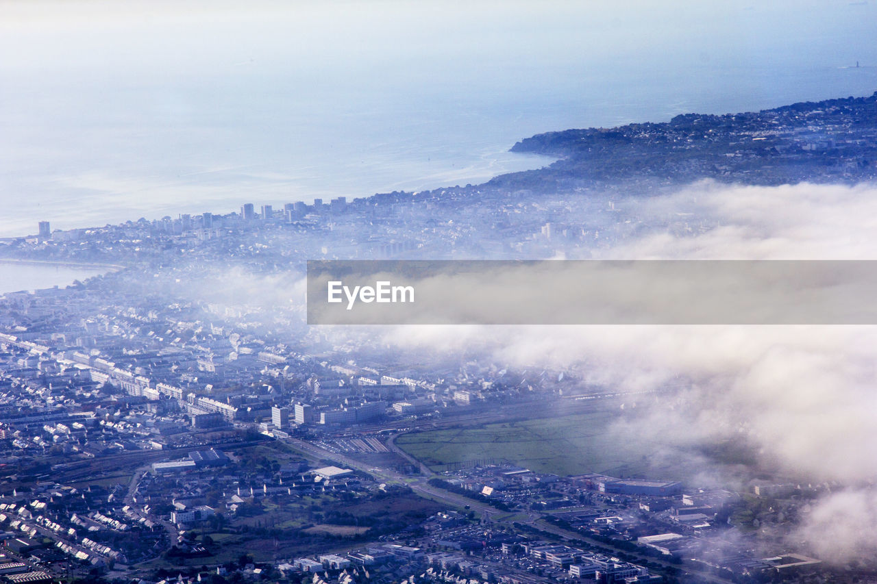 Aerial view of cityscape against sky