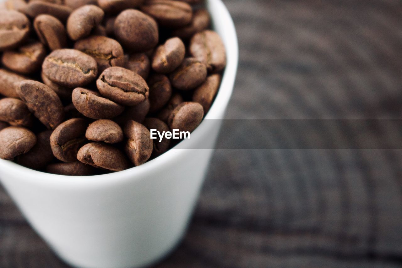 food and drink, food, coffee, drink, freshness, cup, brown, healthy eating, produce, close-up, wellbeing, indoors, roasted coffee bean, still life, large group of objects, bowl, no people, refreshment, table, abundance, studio shot, wood, nut - food, nut, selective focus, snack, copy space, coffee cup