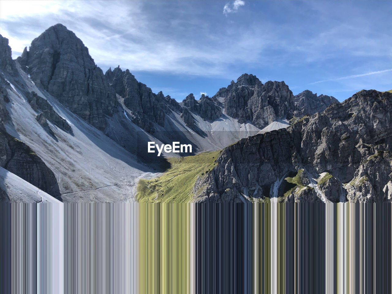 Panoramic view of snowcapped mountains against sky