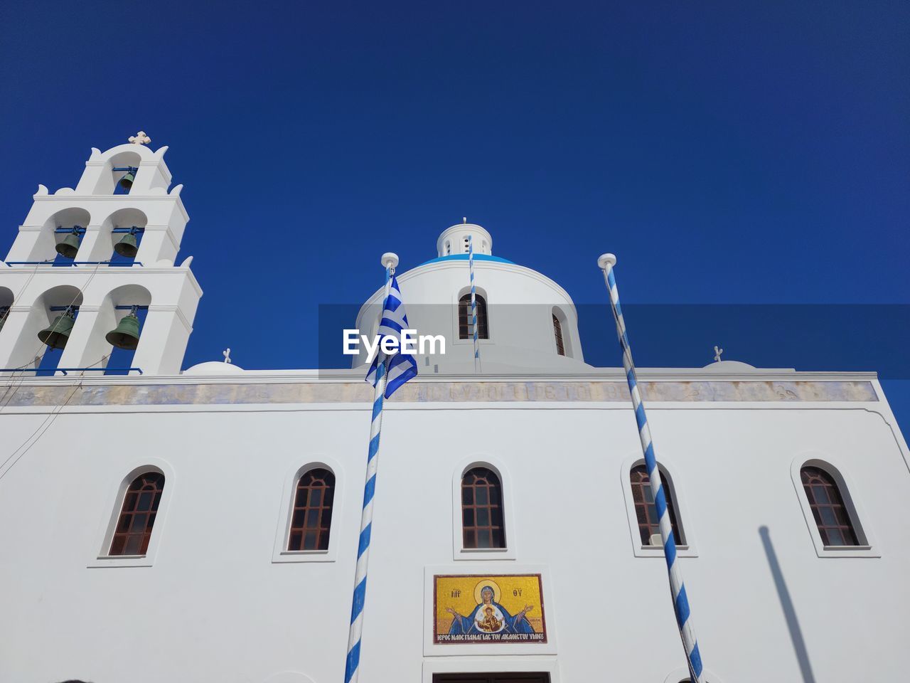 architecture, place of worship, religion, blue, belief, building exterior, built structure, sky, spirituality, clear sky, nature, building, travel destinations, no people, low angle view, catholicism, sunny, travel, day, white, outdoors, arch, tourism, landmark, cross, tower, history, sunlight