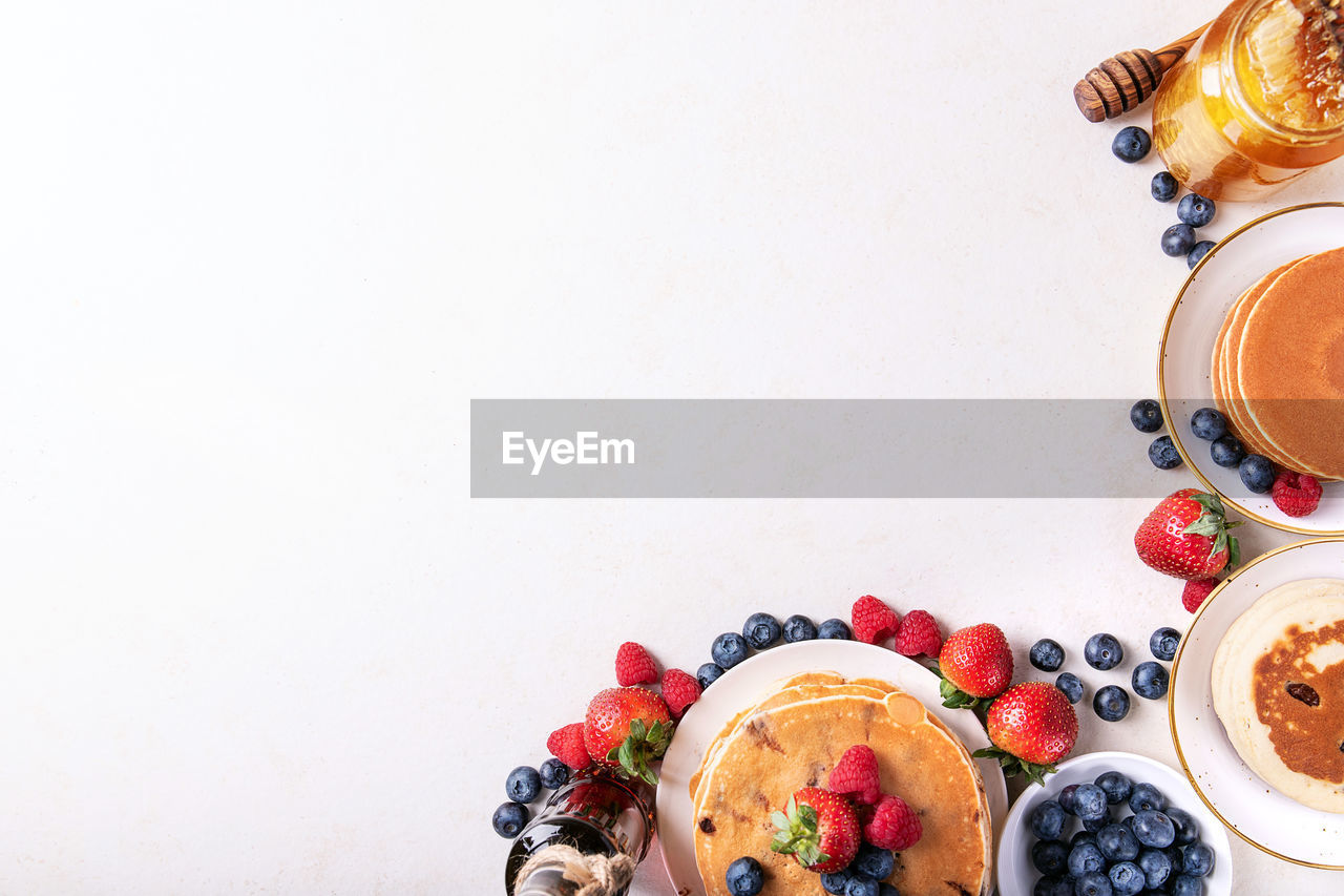 Directly above shot of breakfast against white background