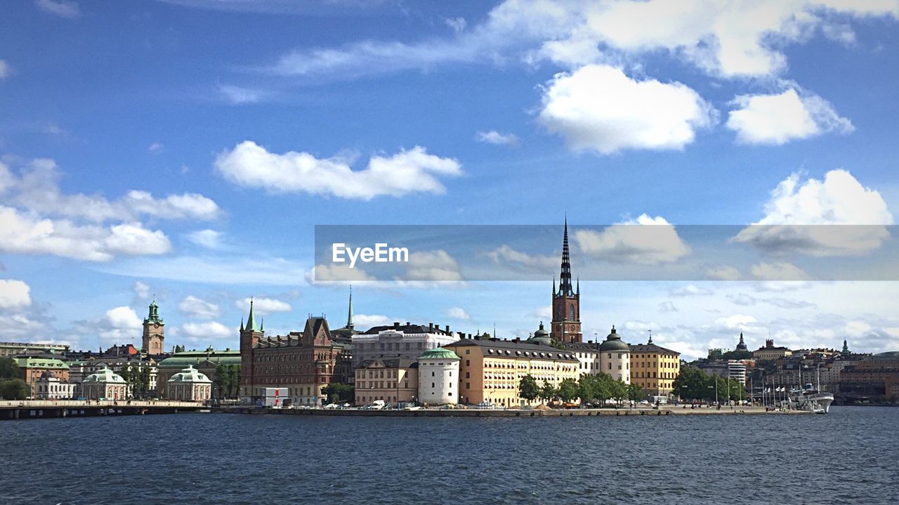 RIVER WITH CITY IN BACKGROUND