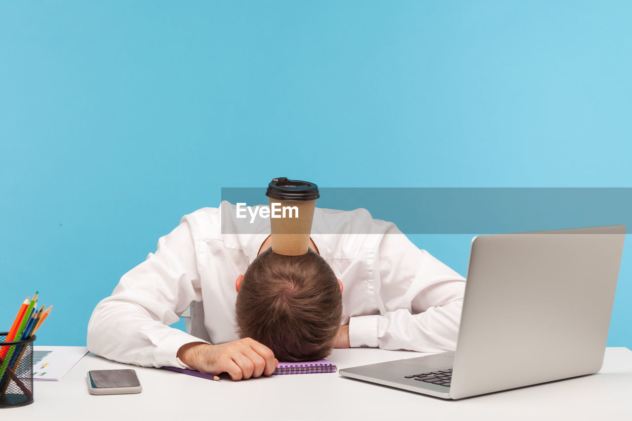 Man using laptop on table