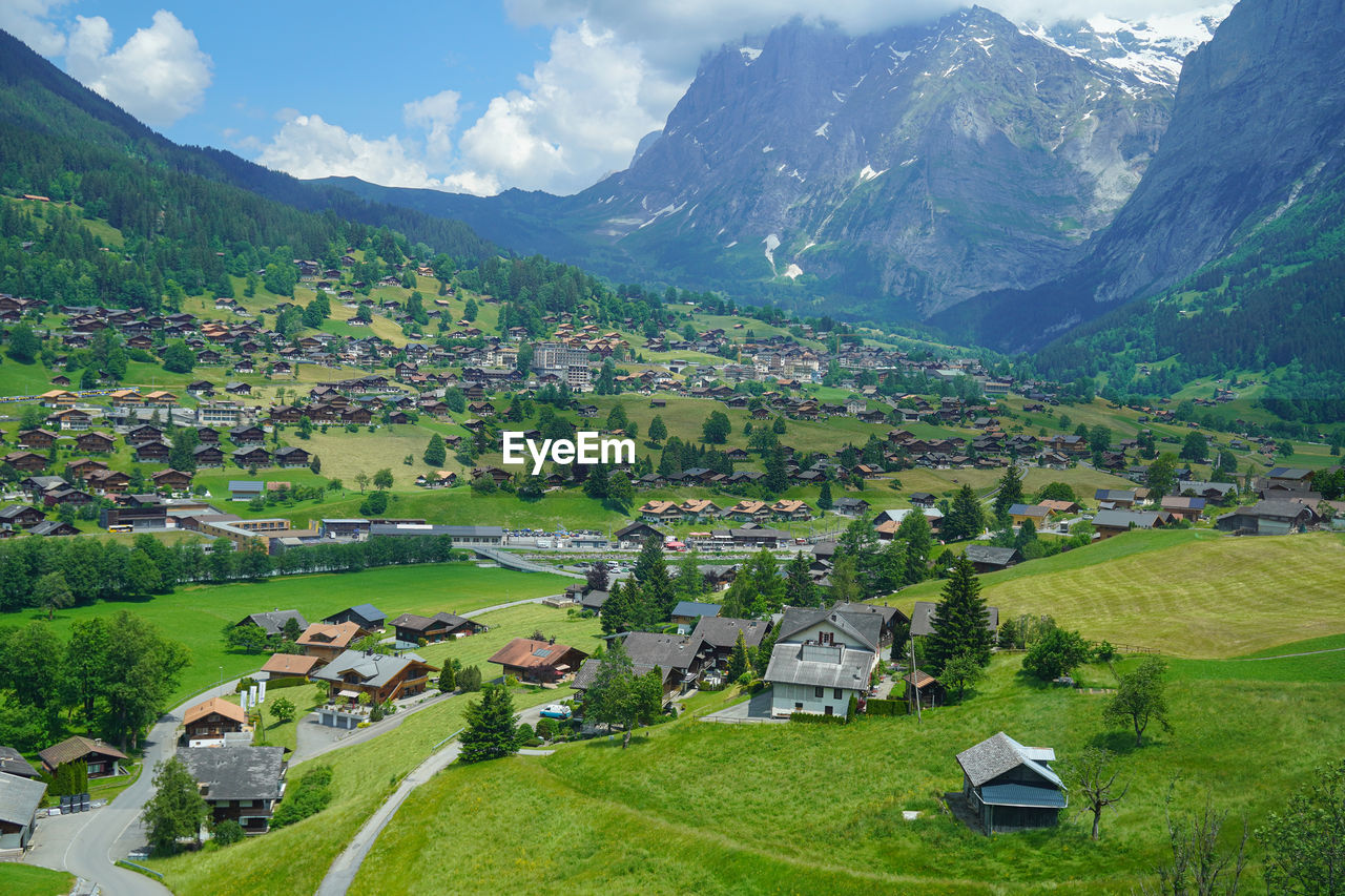 high angle view of houses and mountains against sky