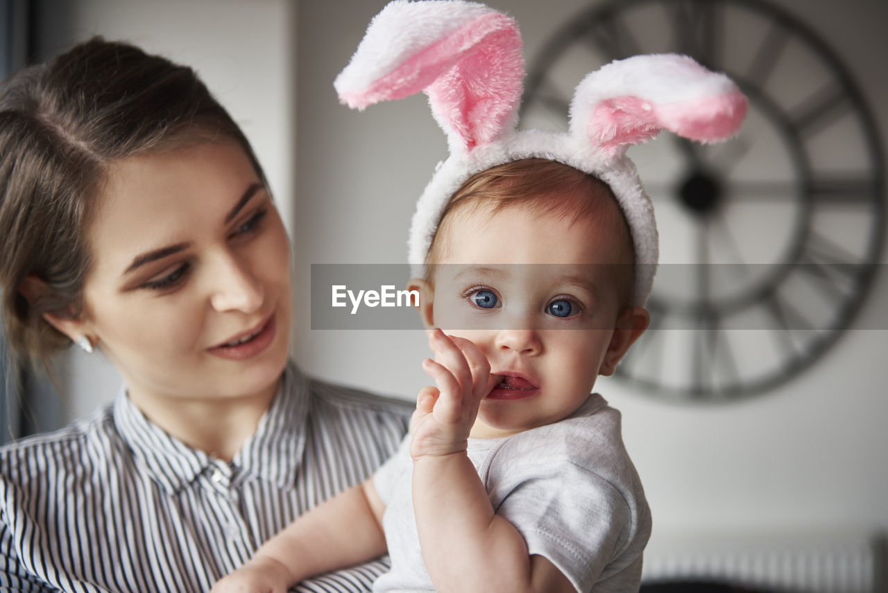 Close-up of mother and daughter at home