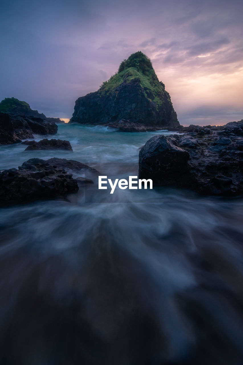 Scenic view of sea against sky at sunset