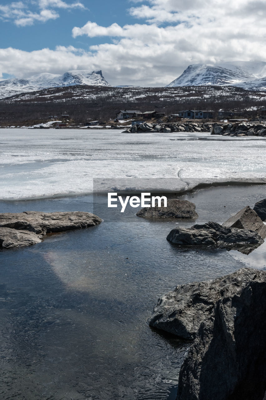 Scenic view of frozen lake against sky