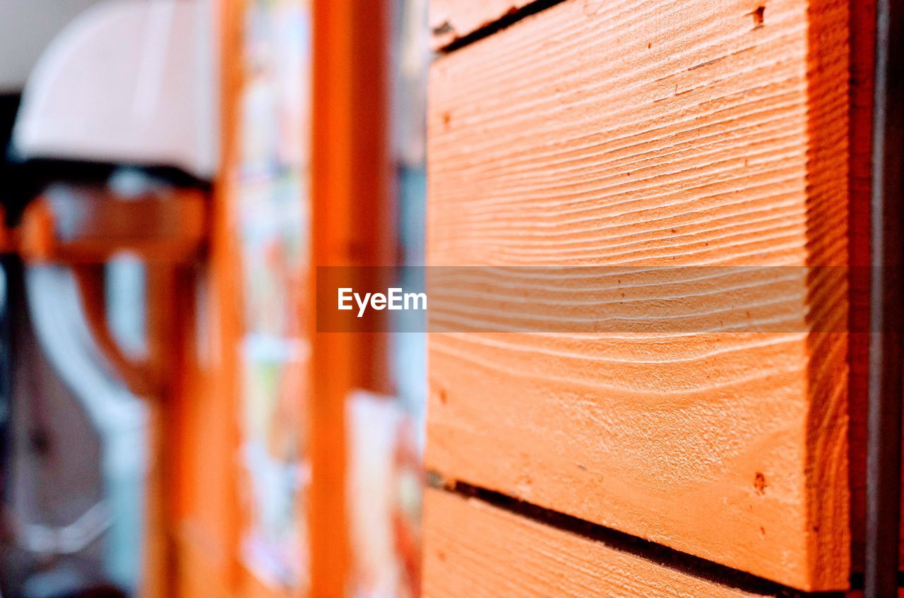 Full frame shot of orange wooden door