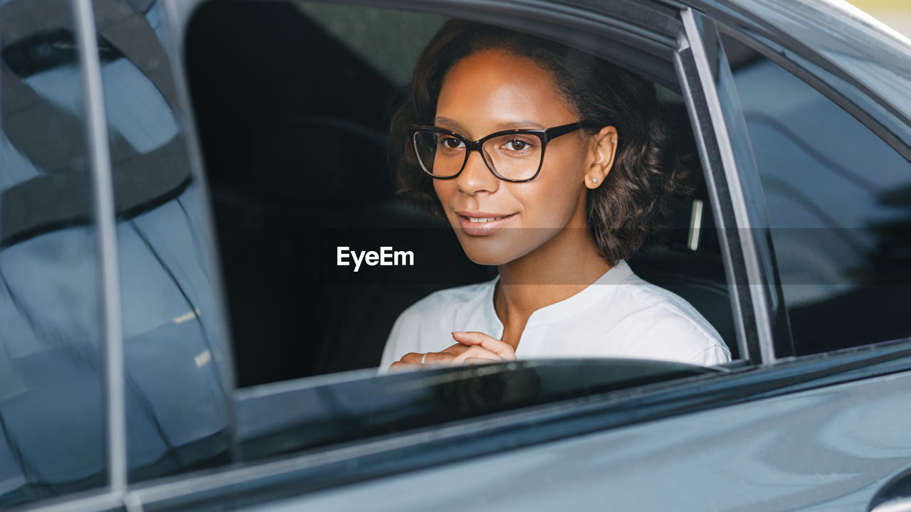 Woman sitting in car