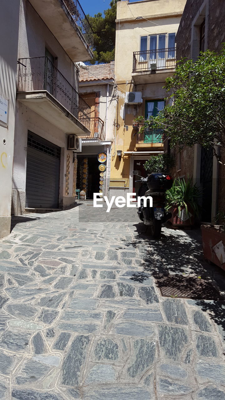 COBBLESTONE STREET AMIDST RESIDENTIAL DISTRICT