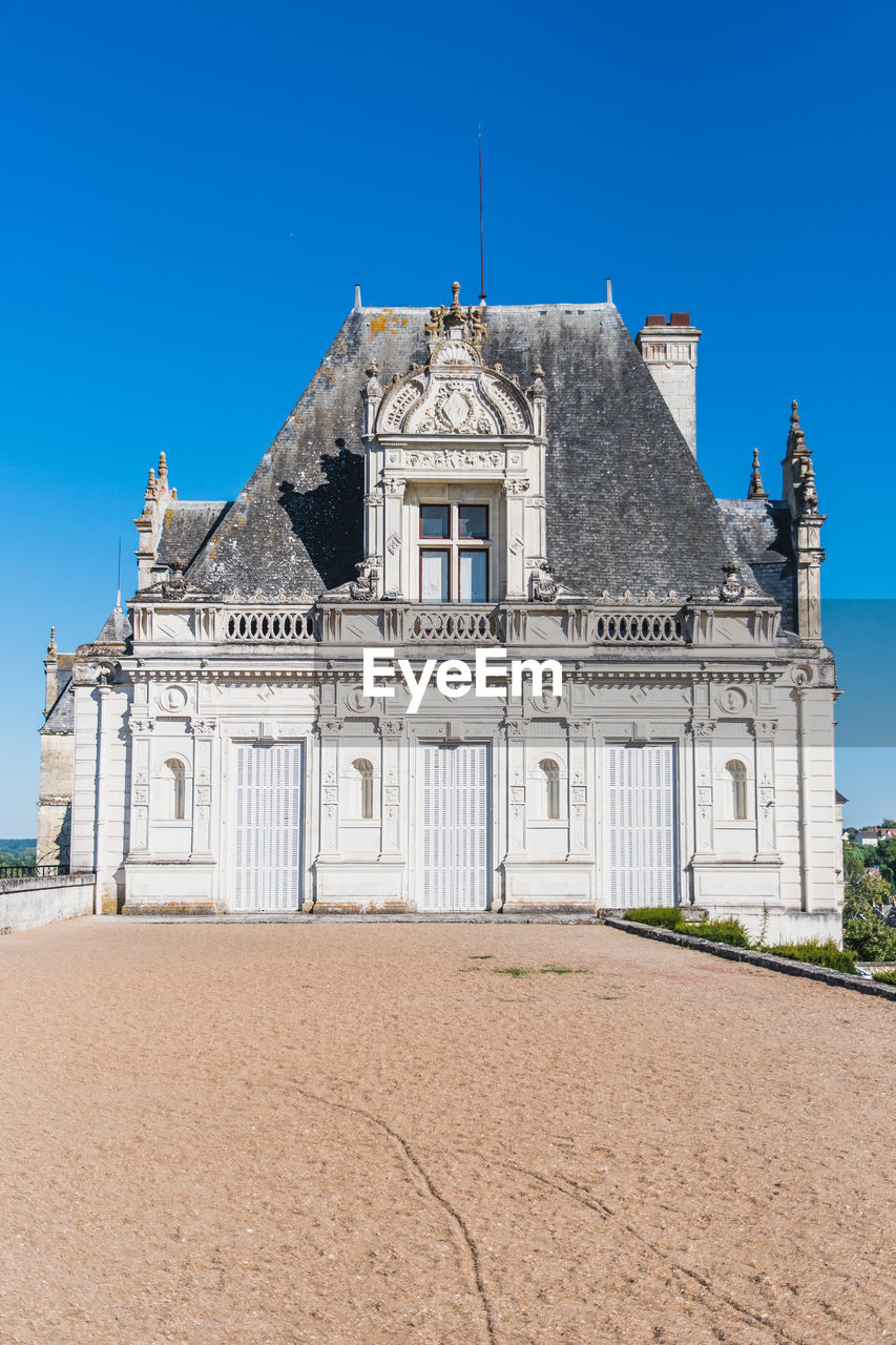 view of old building against clear blue sky