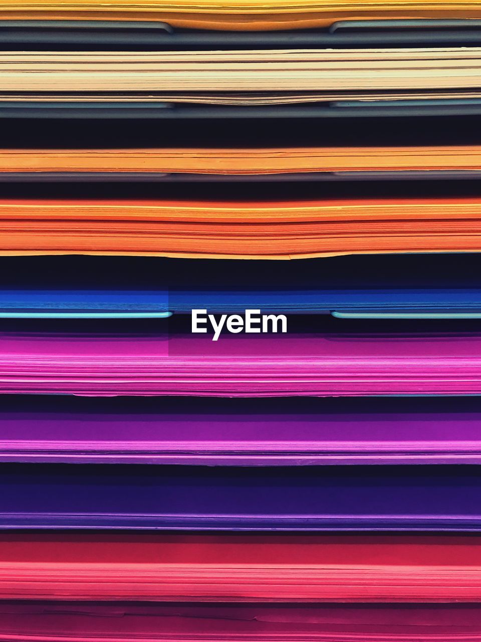 Full frame shot of colorful stacked folders