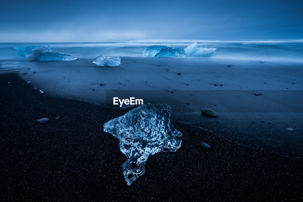 Scenic view of sea against sky during winter