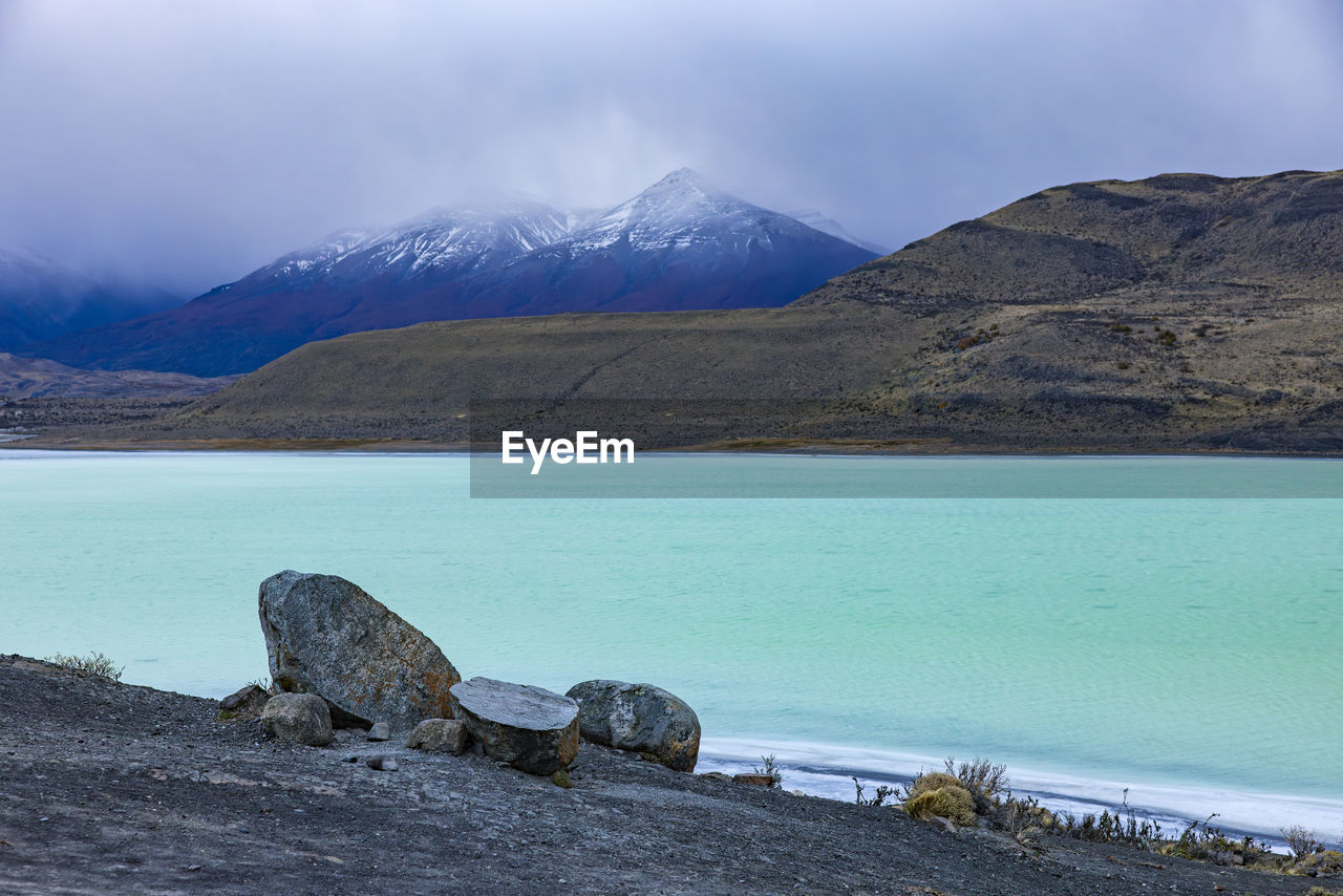 Mystic atmosphere with clouds at the lake laguna amarga in patagonia