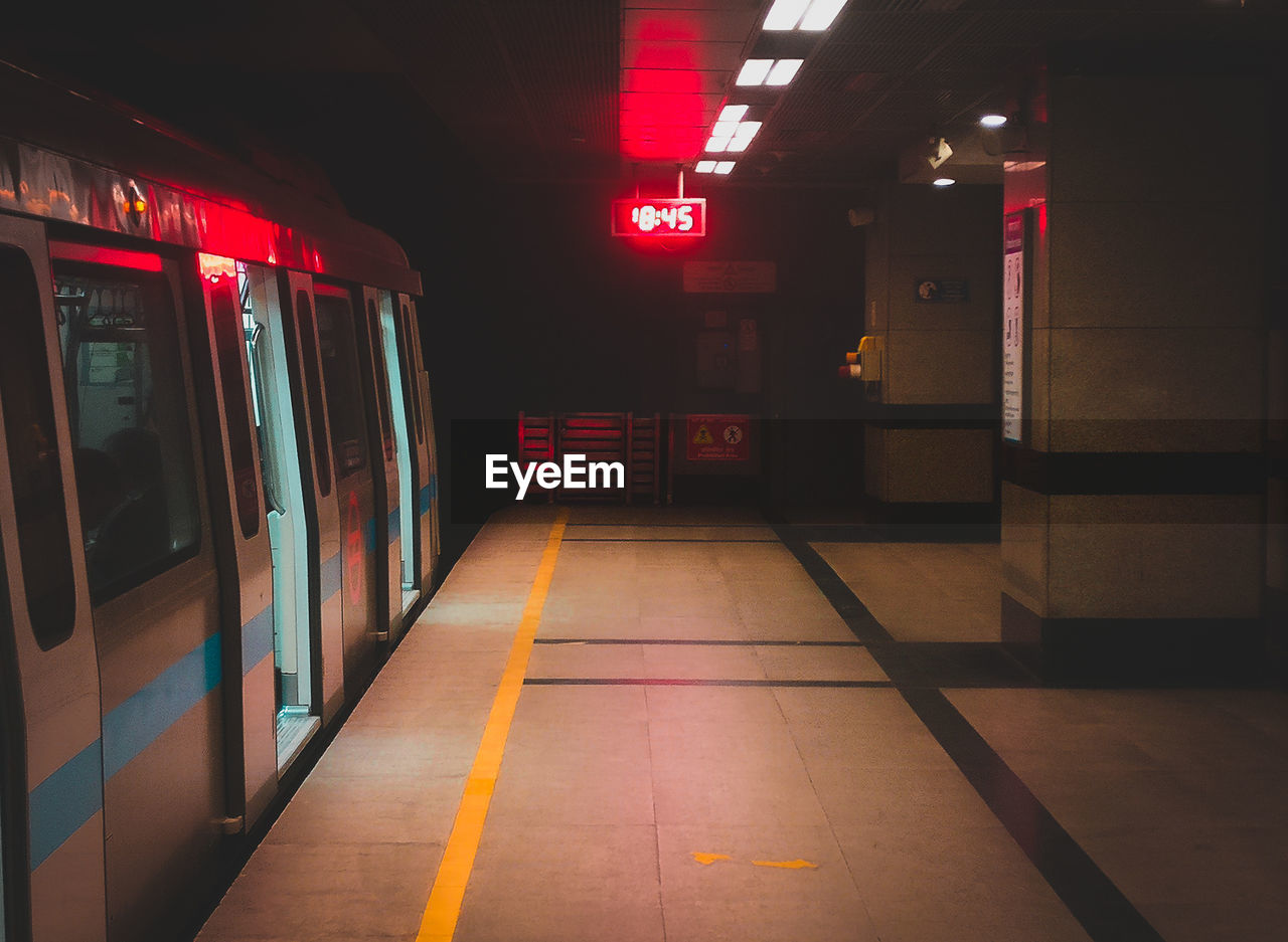 Train at railroad station during night