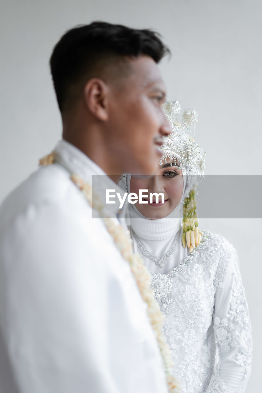 Close-up of bride holding bouquet