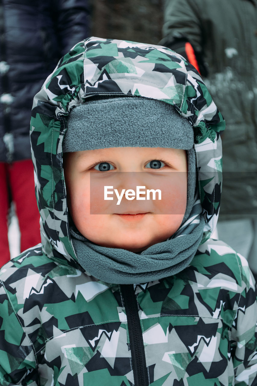 Portrait of cute boy in snow