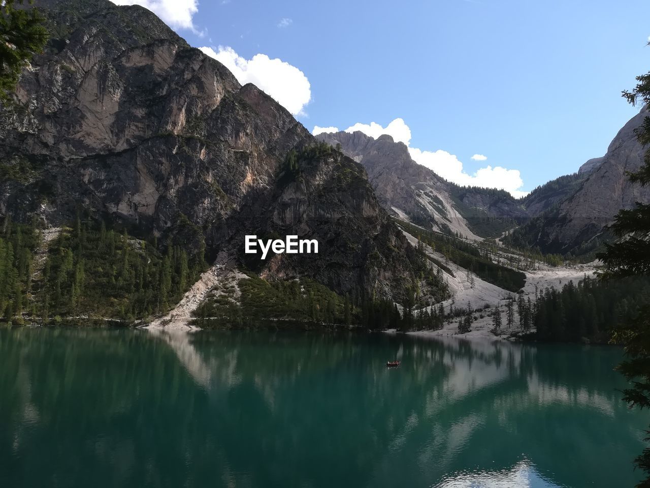 Scenic view of lake and mountains against sky