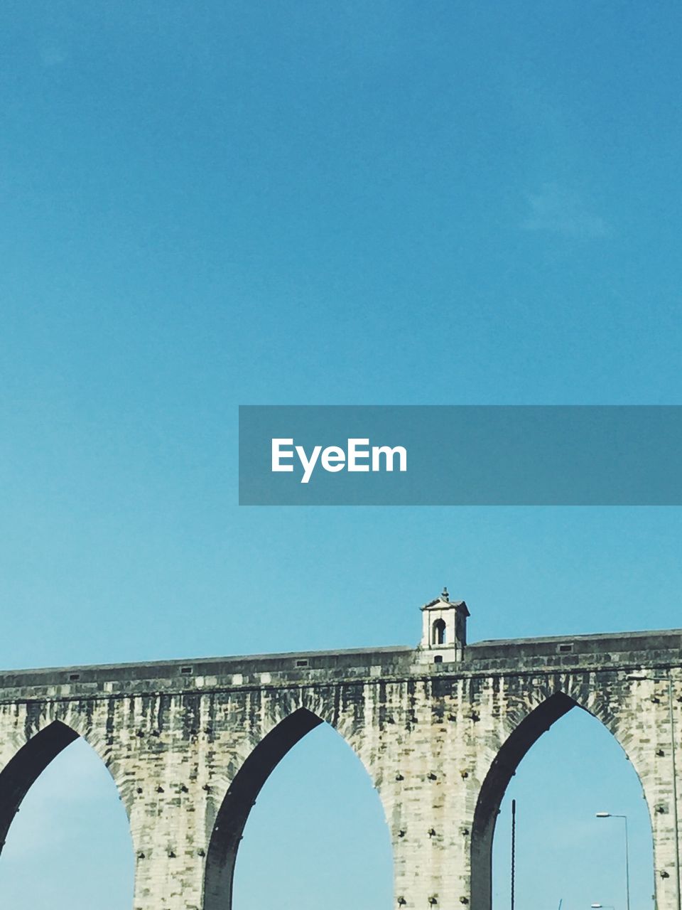 LOW ANGLE VIEW OF ARCH BRIDGE