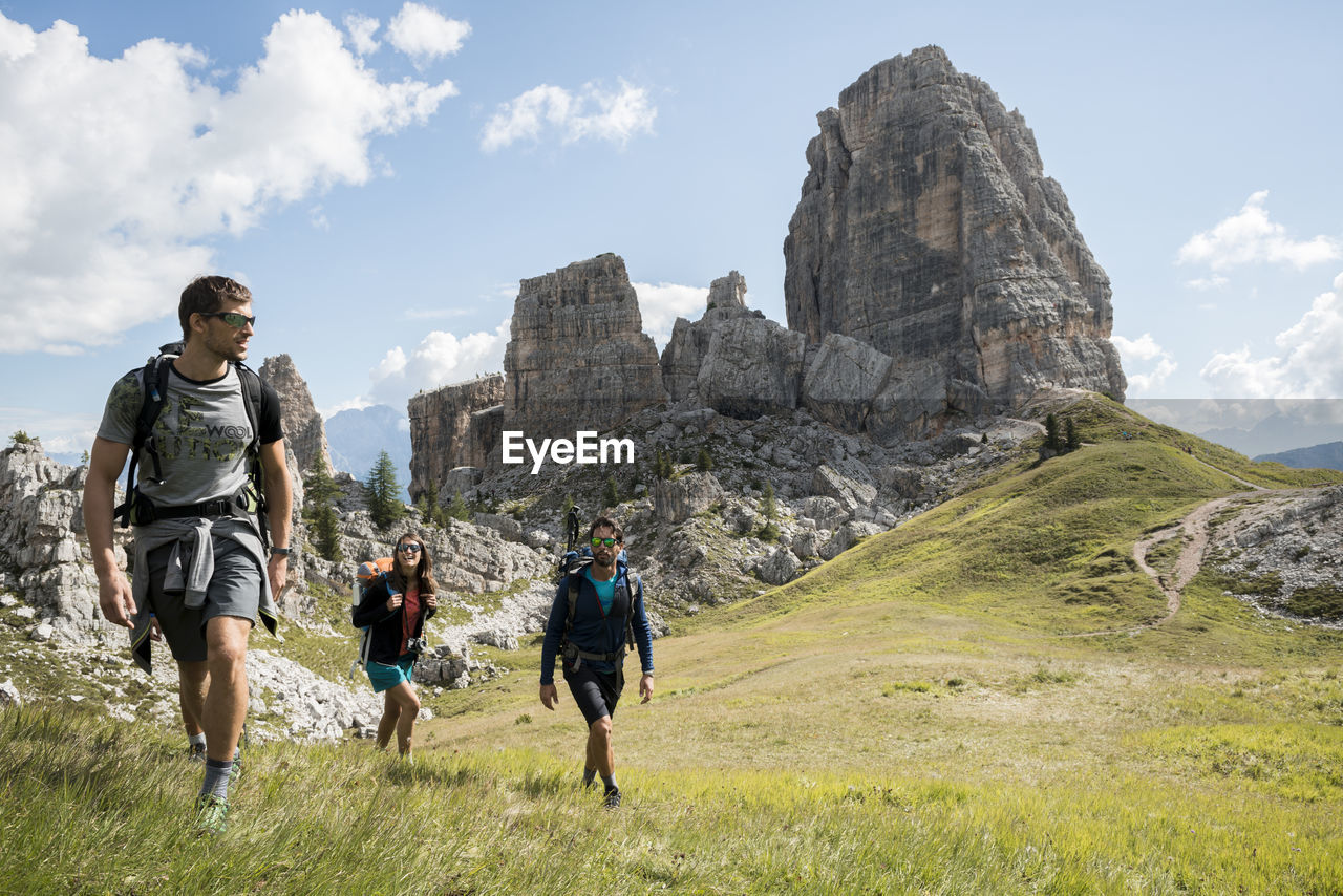 Italy, friends trekking in the dolomtes