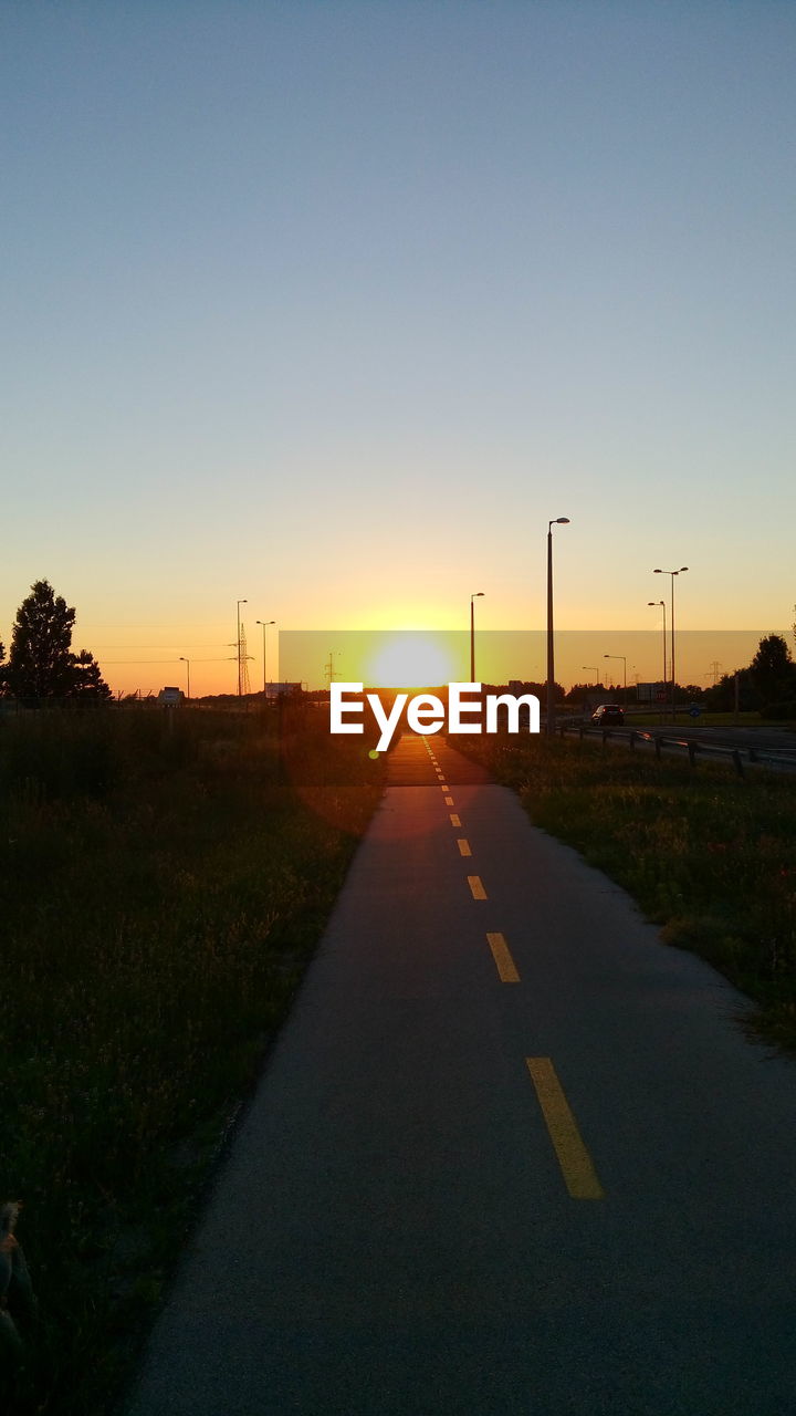 Empty road at sunset