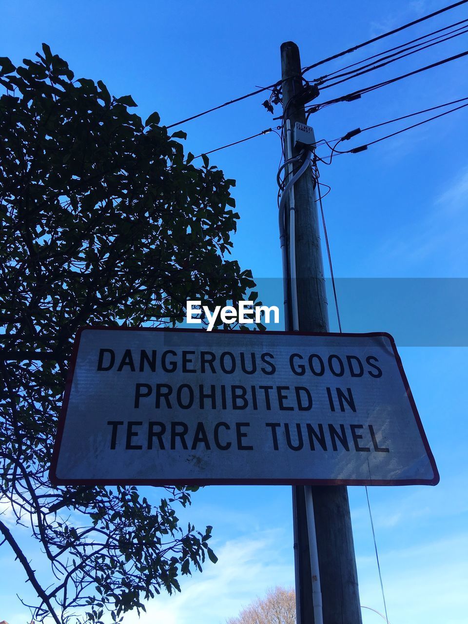 LOW ANGLE VIEW OF ROAD SIGNS AGAINST SKY