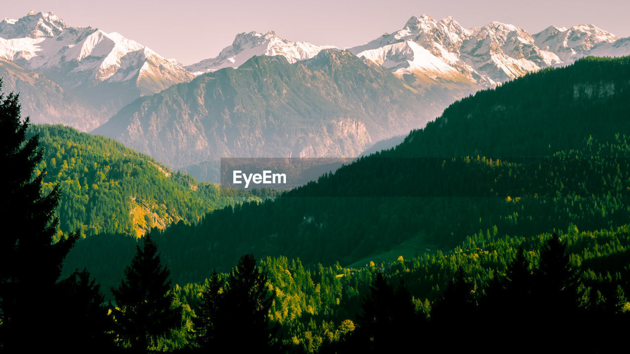 SCENIC VIEW OF SNOWCAPPED MOUNTAINS AGAINST SKY DURING WINTER