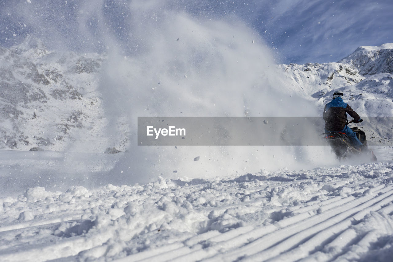 high angle view of man skiing on snow