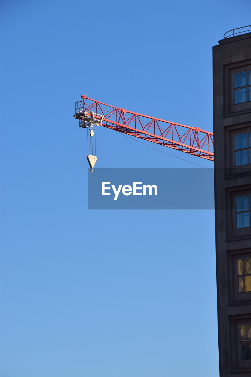 architecture, sky, blue, clear sky, built structure, crane - construction machinery, low angle view, machinery, copy space, nature, building exterior, no people, lighting, day, city, sunny, industry, construction industry, outdoors, construction site, development