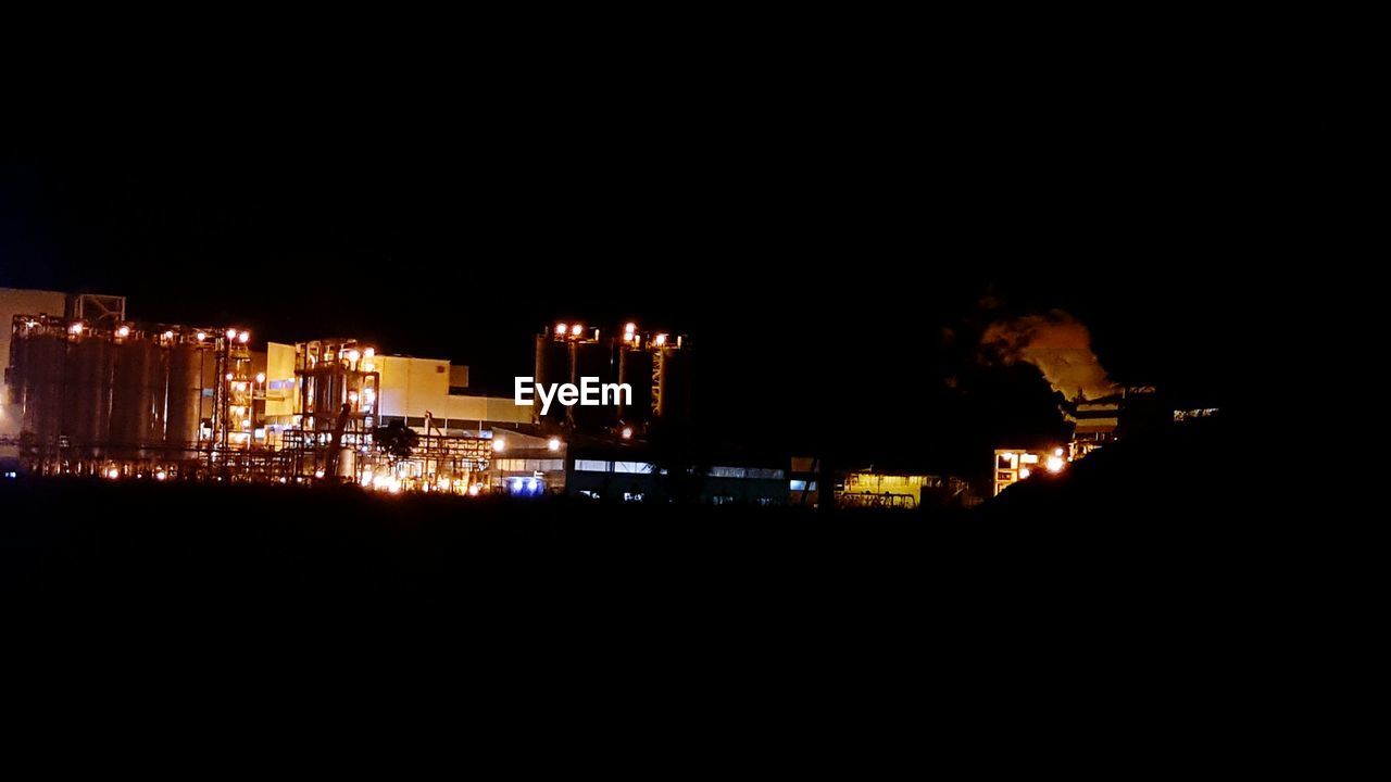 VIEW OF ILLUMINATED BUILDINGS AT NIGHT