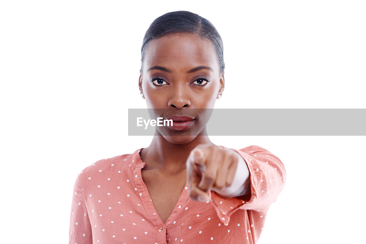 portrait, one person, white background, studio shot, looking at camera, cut out, women, indoors, finger, adult, young adult, headshot, emotion, front view, human face, hairstyle, hand, copy space, female, facial expression, person, casual clothing, pink, waist up, human head, lip, smiling, lifestyles, nose, positive emotion, relaxation, serious, brown eyes, child, happiness