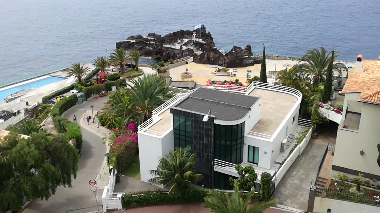 VIEW OF TOWN WITH SEA IN BACKGROUND