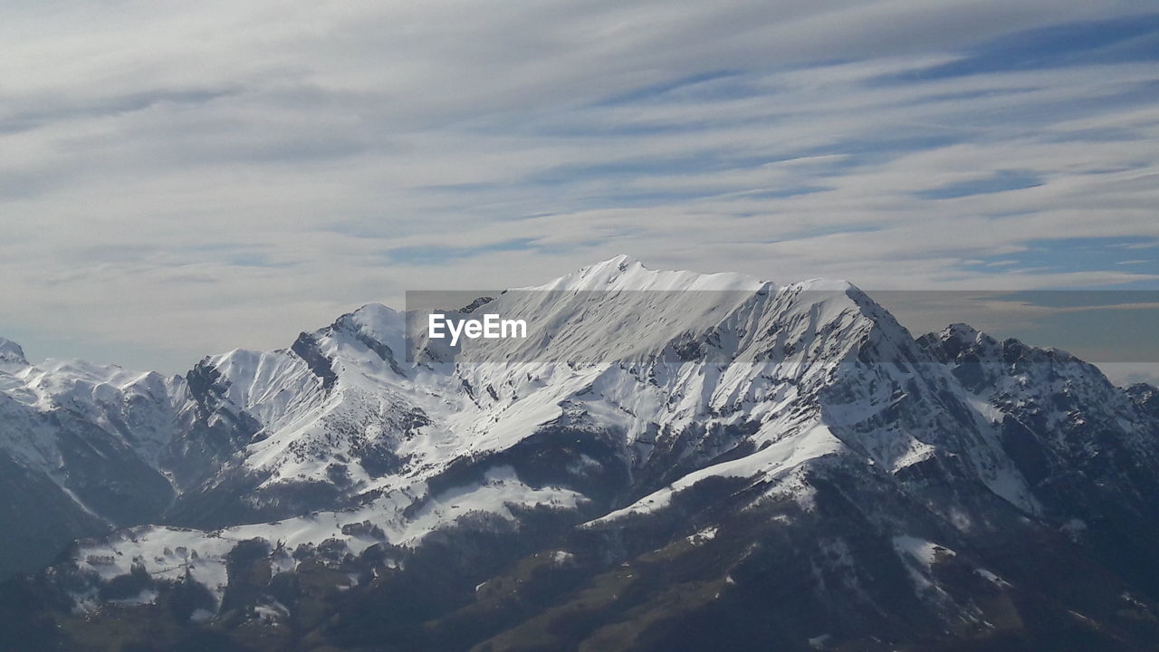 Scenic view of snowcapped mountains against sky