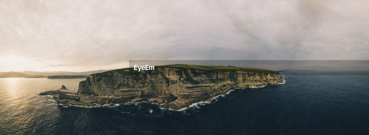 Rugged cliff coastline panorama agains the atlantic ocean in cantabria, spain.