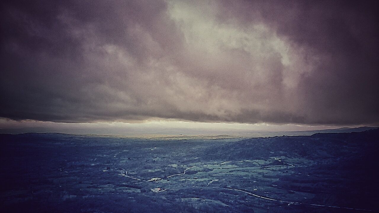 VIEW OF SEA AGAINST CLOUDY SKY